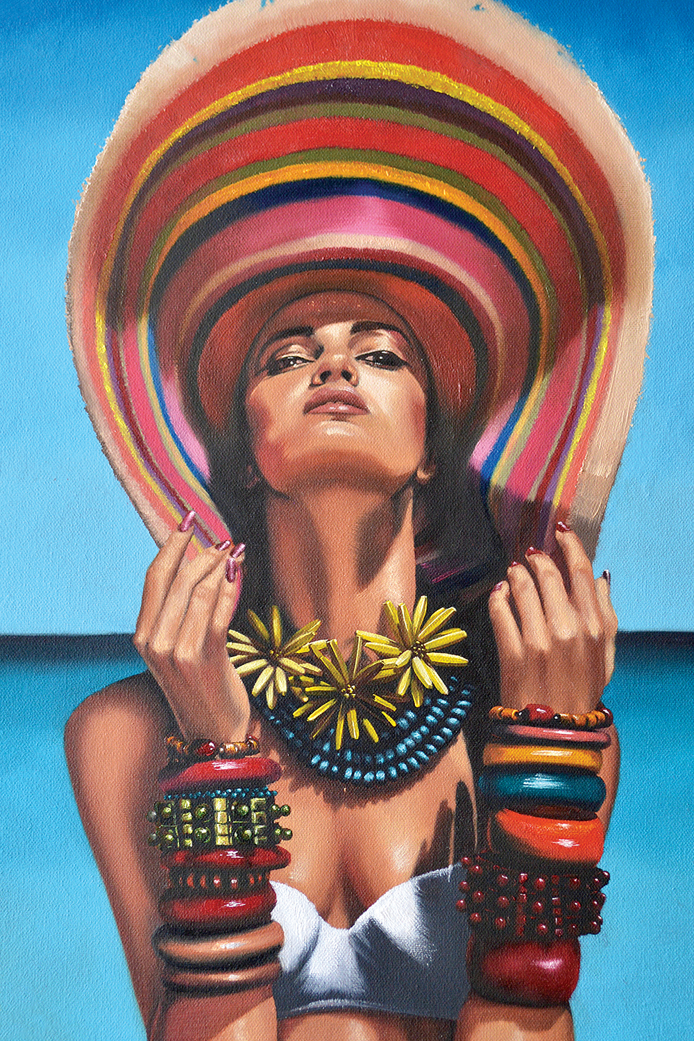 woman wearing large colorful sun hat, oversized necklaces, many bracelets, and white bathing suit top in front of blue