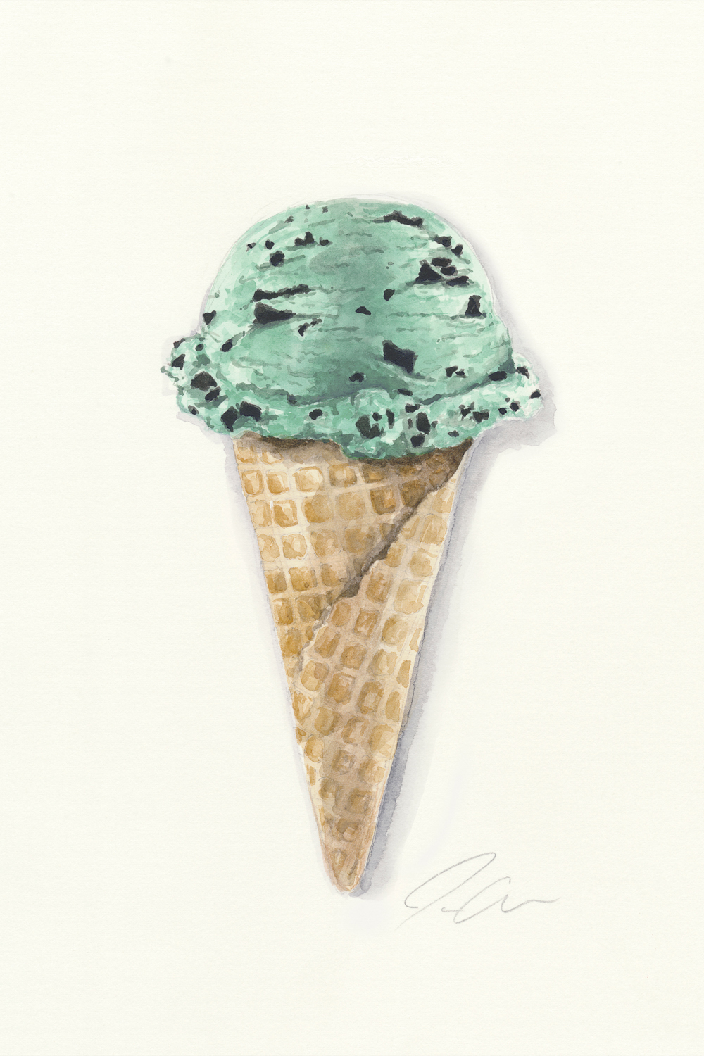 a single scoop of mint chocolate chip ice cream in waffle cone