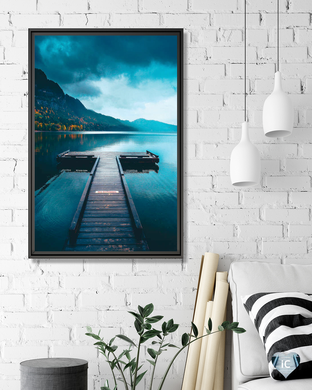 an empty boat dock with woods and clouds in view on a calm, blue lake