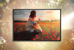 woman wearing a dress with shall sitting in field of poppies at sunset while looking away