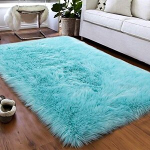 Light blue shaggy faux sheepskin area rug