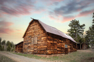 Photo of wood barn under a dusky sky