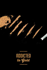 Gold flakes cut up into lines with a rolled up dollar bill next to them and text underneath that says "Addicted to gold" on a black background