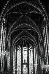 Black and white photo of the vaulted ceiling of a Gothic cathedral