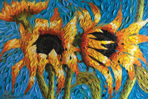 Three large sunflowers on blue background with texture