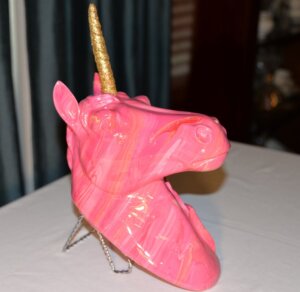 Wall mount figurine of pink unicorn with gold sparkling horn