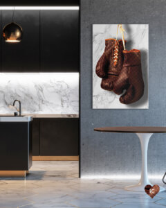 Boxing gloves with Louis Vuitton monogram print on a white marble background on a wall in a room with brown table and gold lamp and a kitchen with a white marble backsplash
