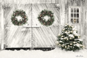 Double white barn doors with a Christmas wreath hanging on each door with snow falling next to a window with a lit candle inside of it and a bush with string lights next to the doors