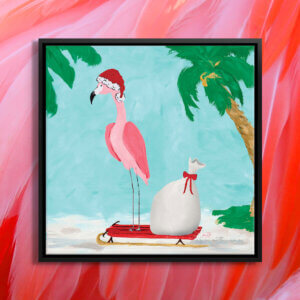 Pink flamingo wearing a Santa hat standing on a red sled on the beach