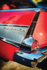 Photo of the rear end tail fin of a red Chevy Bel Air
