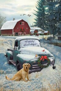 Image of a vintage green pickup truck covered in snow with &quot;Happy Holidays&quot; written on the windshield and a golden retriever next to it with a red barn and trees in the background