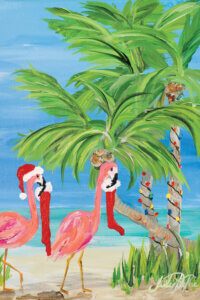Two pink flamingos wearing Santa hats and carrying stockings by a palm tree with Christmas lights wrapped around it on a beach