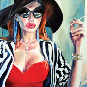 Woman with red hair and cat-eye sunglasses and a floppy black hat and striped blazer smoking a cigarette