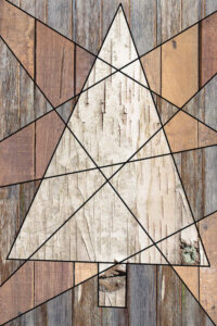 Wood textured image of a triangular Christmas tree