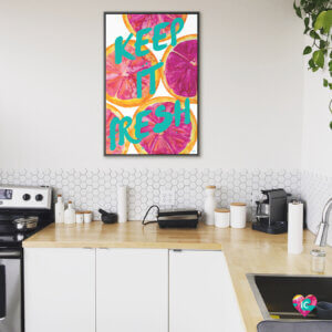 “Fresh & Sweet I” by Nola James shows the words ‘keep it fresh’ written in blue against pink-colored grapefruits.