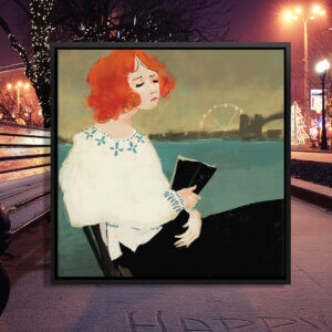 “Talk To The City” by Anikó Salamon shows a woman with orange hair reading a book while sitting in front of a lake with a ferris wheel and bridge in view.