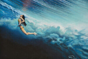 “Dancing Beneath The Clouds” by Antoine Renault shows a woman wearing a bikini submerged beneath an ombre sea.