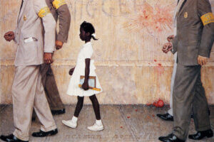 “The Problem We All Live With (Ruby Bridges)” by Norman Rockwell shows an African American girl, 6-year-old Ruby Bridges, wearing a white dress as she's escorted by four federal marshals to her first day of class at an all-white school in 1960, as racial slurs and tomatoes remnants display on the wall behind her.