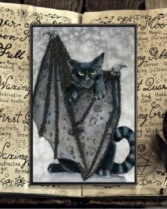 “Furling” by Maggie Vandewalle shows a black cat with black bat wings and green eyes.