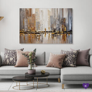 “Streets I” by Osnat Tzadok shows an abstraction of a city skyline against a water&#039;s edge using paint strokes in gold, gray, white, and brown