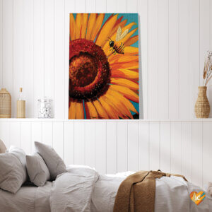 “Sunflower Bee” by Debbie Criswell shows a bee flying in front of a yellow sunflower.