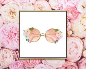 “Lets Chase Rainbows XX” by Jenaya Jackson shows rose-colored glasses with flower details on the rims.