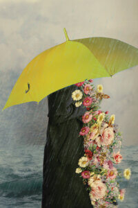 Healing by Deandra Lee shows a person holding a yellow umbrella while engulfed in colorful florals