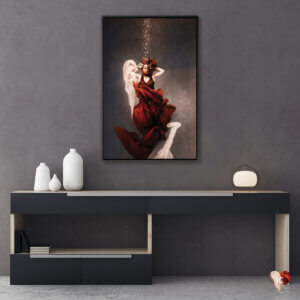Surrender by Lola Mitchell showcases a woman floating underwater and wrapped in red fabric