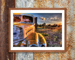 Rusty truck at golden hour by iCanvas artist Bob Larson