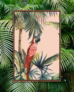 Framed wall art of a parrot on a palm tree by iCanvas artist Eva Watts against a palm tree background