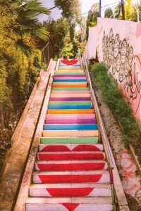 Wall art of rainbow heart Micheltorena stairs in California by Bethany Young