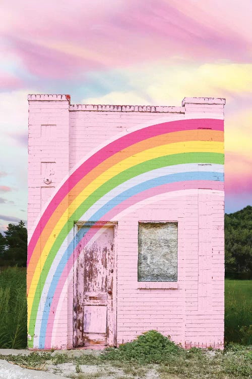 Wall art of a pink building with a rainbow across it by iCanvas artist Erin Summers