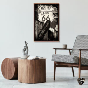 Wall art of Route 66 photograph by Philippe Hugonnard above a wooden table and chair by