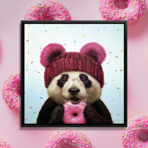Wall art of a panda with a pink hate eating a pink sprinkled donut by Lucia Heffernan against a collage of pink donuts
