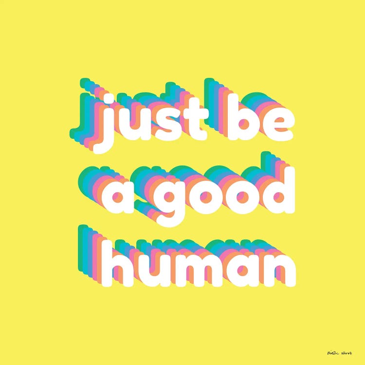 Yellow wall art with just be a good human written in rainbow colors by female artist Kristin Wood