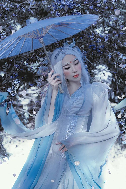 Photography of an Asian woman in blue with a blue parasol by iCanvas artist Lillian Liu