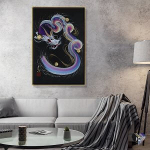 Framed wall art of rainbow dragon by iCanvas artist One-Stroke Dragon above a gray couch