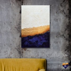 Gold blue and white abstract art by iCanvas artist Spellbound Fine Art above a yellow couch