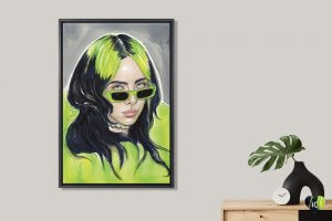 Wall art of Billie Eilish in green above plant