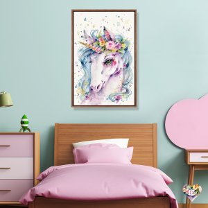 Young girls pink and blue bedroom with framed wall art of a colorful watercolor unicorn in a flower crown by Sillier Than Sally