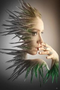 Multimedia art of a womans face merged with leaves by iCanvas artist fndesign art