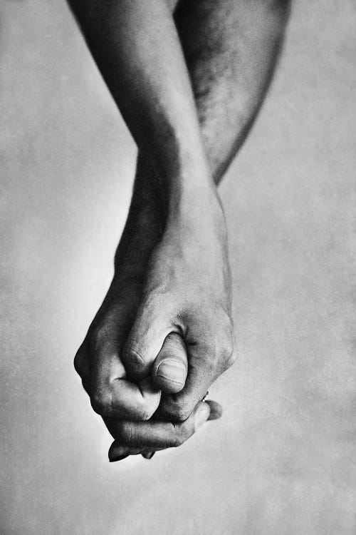 Black and white photography of two hands holding by new iCanvas artist Milica Tepavac