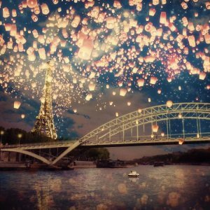 Wall art of the Seine and Eiffel Tower with paper lanterns in the sky