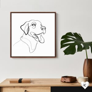 Framed black and white continuous line drawing of labrador with its tongue out mounted by a plant