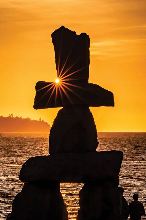 Golden hour photography of a rock sculpture in front of the ocean at sunset by new artist Colin Kemp Photography