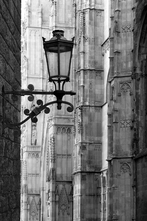 Black and white photograph close up of a lamp post and a cathedral by iCanvas artist Jeff Friesen