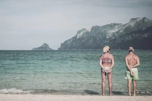 Authentic photography of the backs of an old couple facing the ocean by iCanvas artist Florian Schleinig