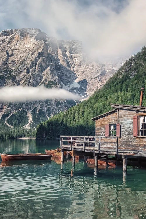 Nature art of cabin and canoe on lake in front of mountains and trees by new icanvas creator Manjik Pictures