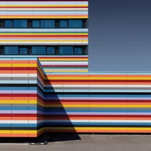 Rainbow art similar to art installation featuring rainbow lines on building by iCanvas artist Markus Kuhne