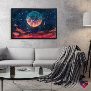 Framed surreal moon art above gray couch by icanvas artist Valery Rybakow
